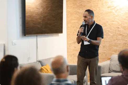 A mentor speaking to the room at VentureHack